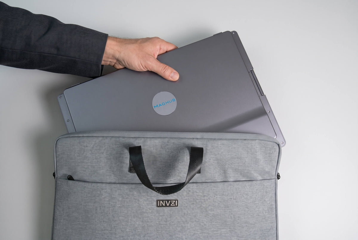 Professional carrying a folded MagHub Quad Max display system